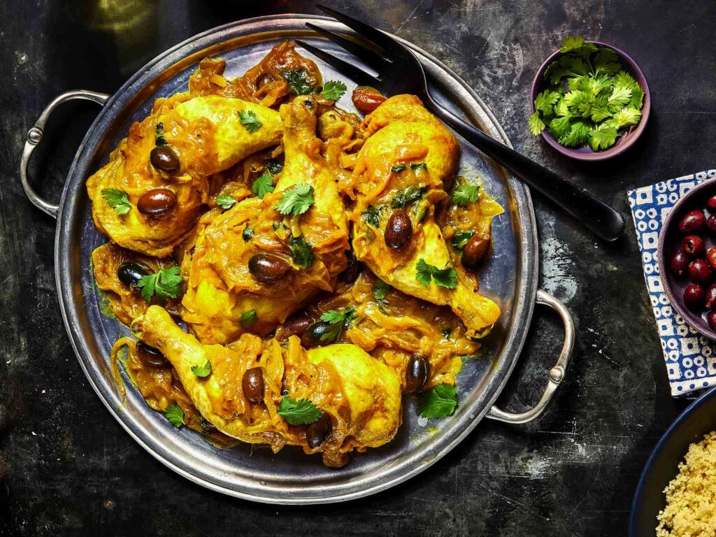 Traditional Moroccan tagine recipe for a saffron chicken with preserved lemon and kalamata olives.